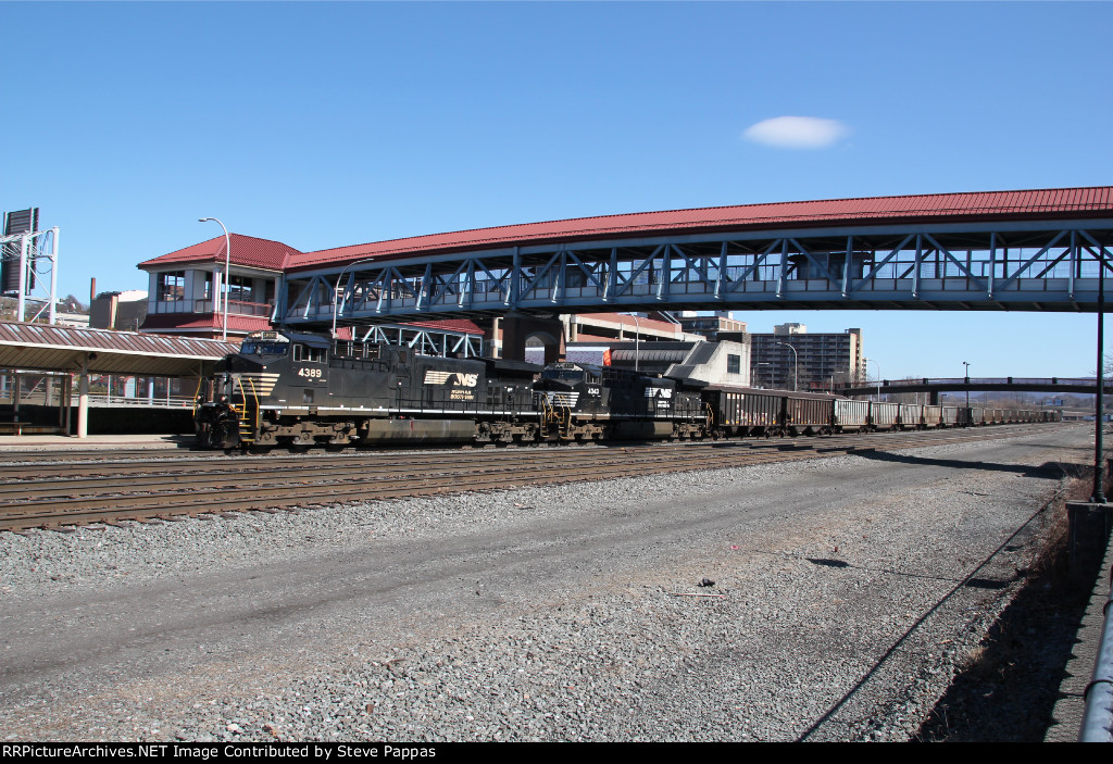 NS 4389 and 4343 take train 595 west with empty coal hoppers